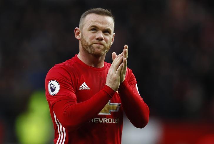 Rooney slams 'disgraceful' treatment over photos